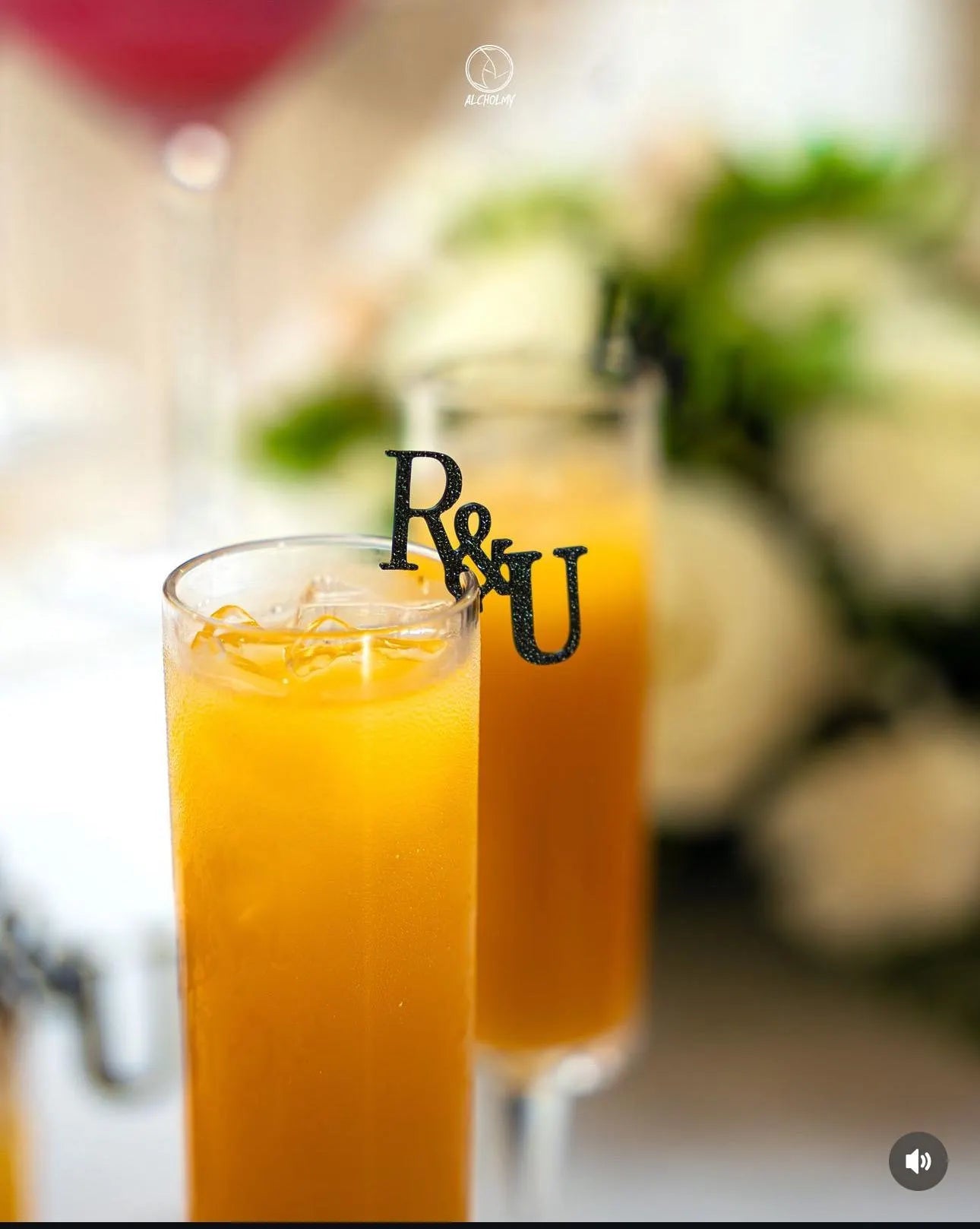 Zoomed-in image of custom wedding drink topper featuring intricate design and black accents.