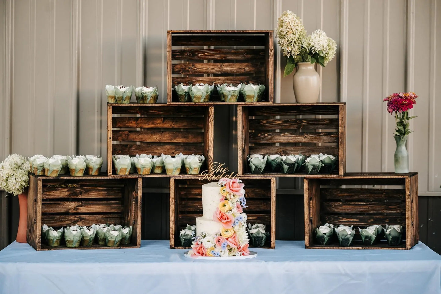 Unique wedding cake topper with elegant design, adding a personalized touch to a multi-tiered cake.