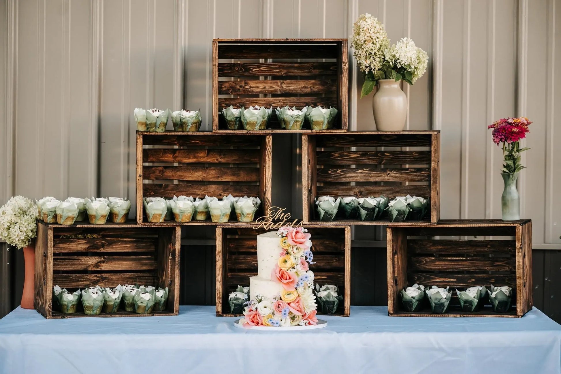 Unique wedding cake topper with elegant design, adding a personalized touch to a multi-tiered cake.